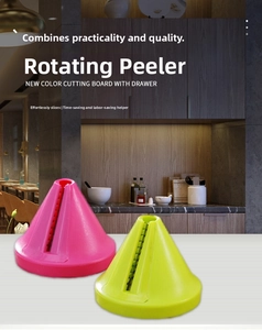 Close-up of manual rotary vegetable graters in vibrant pink and green colors