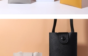 Detail of minimalist phone crossbody bag with snap button closure and slim shoulder strap