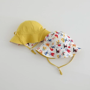 Detail of baby sun hats featuring adjustable chin straps and colorful doodle print fabrics