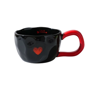 Minimalist black ceramic heart mug with red handle and inner Love text print