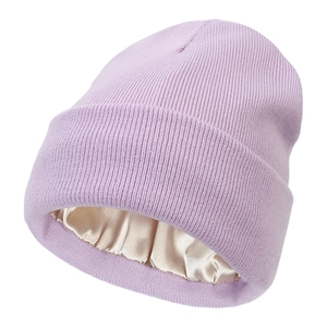 Detail view of lavender knit beanie featuring smooth champagne satin lining for hair care