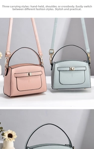 Detail of crossbody bag featuring pebbled faux leather and metal twist lock closure