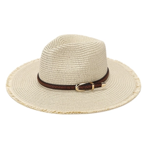 Beige straw fedora hat with frayed brim and brown braided leather strap for beach vacation