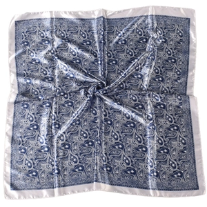 Detailed close-up of navy blue paisley pattern on glossy satin silk-like square scarf