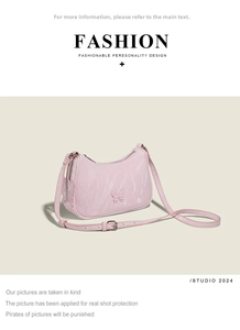 Detail view of pink leather underarm bag featuring embossed butterfly and charm