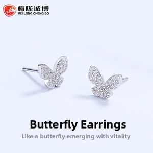 Macro view of butterfly stud earrings in S925 silver with micropave white zircon stones