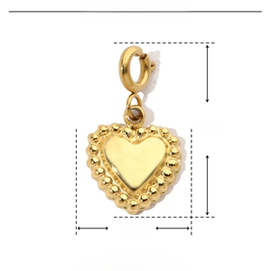 Macro shot of gold stainless steel heart pendant with size dimensions 18mm by 10mm