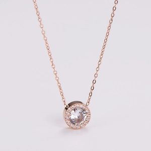 Close-up of rose gold necklace with round cubic zirconia pendant and pavé stones