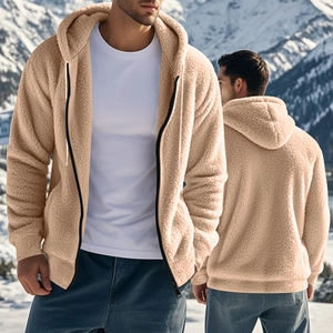 Detail of warm beige sherpa fleece hoodie with zipper and hood for men in outdoor mountain setting