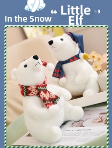 Detail of soft white Christmas polar bear plushies with cozy knitted hats and red scarves