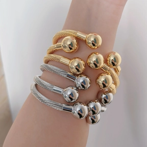 Adjustable French retro twisted cable bangle with gold and silver bead finishes