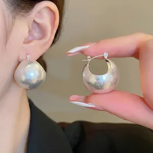 Sleek silver U-shaped bubble earrings featuring a matte finish and minimalist hoop design
