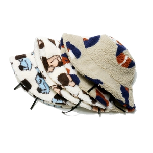 Detail of plush bucket hats in assorted floral and animal patterns for winter