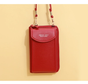 Detail of red faux leather phone bag with Forever Lovely text and zipper pocket