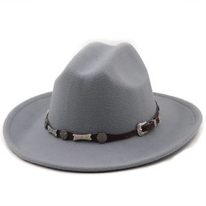 Detail of grey felt cowboy hat featuring leather band with silver star metal ornaments