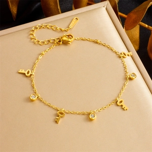 Gouden roestvrijstalen kettingarmband met sleutelhangers en kristallen voor dames