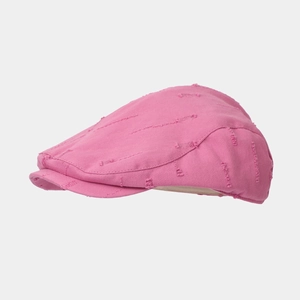 Detail view of pink distressed cotton canvas flat cap with retro frayed hole accents