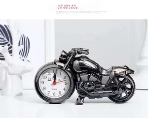 Close-up of a creative motorcycle shaped alarm clock with dark grey finish and quartz dial