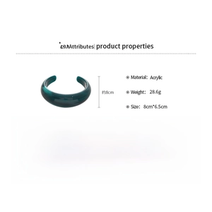 Detailed view of dark green acrylic bangle with marble texture measuring 8cm by 6.5cm