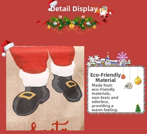 Detail of Christmas burlap gift bag with Santa boot print and festive lettering