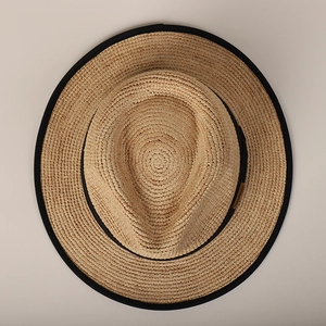 Classic straw flat top boater hat with black ribbon trim and wide brim for sun protection