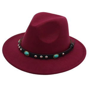 Detail of burgundy fedora hat with black leather band and turquoise stone accent