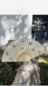 Close-up of Su Embroidery silk fan with colorful butterflies on bamboo frame