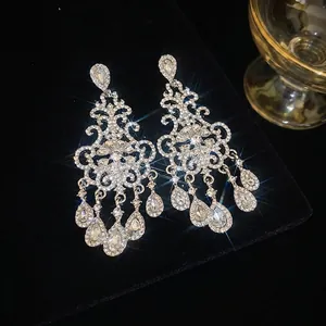 Silver flower drop tassel earrings with sparkling crystals and elegant dangle design
