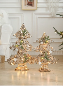 Detail of champagne iron-wrought Christmas tree set with LED lights and jute fibers