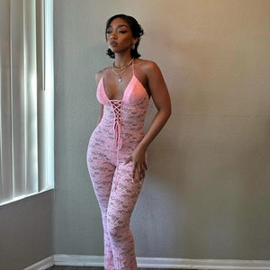 Sexy pink lace halter neck jumpsuit with sheer hollow out pattern and backless design