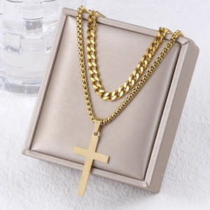 Double-layer gold stainless steel necklace with cross pendant on jewelry box display