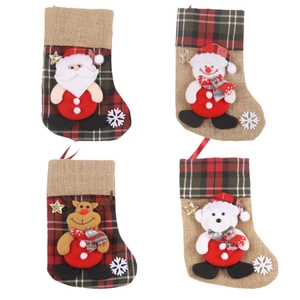 Set of four Christmas stockings with Santa, reindeer, and snowman for holiday home decor