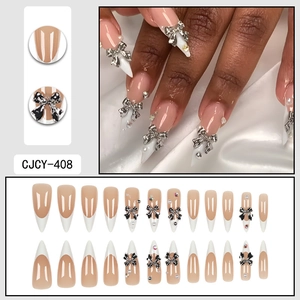 French tip press-on nails with 3D bows and pearls on elegant stiletto almond shape