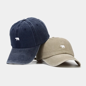 Washed cotton baseball caps with bear embroidery in navy blue and khaki color
