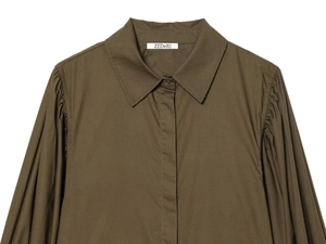 Detailed view of the olive green poplin shirt featuring pleated puff sleeves and a classic collar