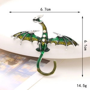 Detail of vintage dragon brooch with dimensions 6.7cm by 6.1cm and enamel finish