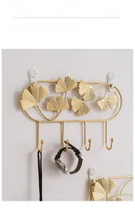 Detail of golden ginkgo leaf wall hooks for entryway storage and decorative hanging