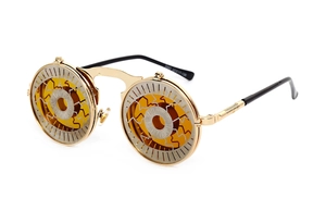 Detail of steampunk flip-up sunglasses with golden frames and amber lens