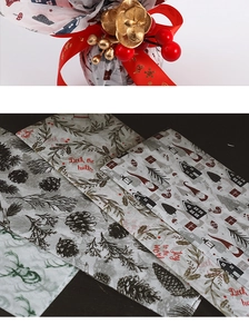 Detail of Christmas tissue paper with reindeer and pine patterns for gift wrapping
