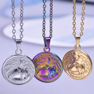 Three round fox pendants in gold, silver and aurora finishes on stainless steel chains
