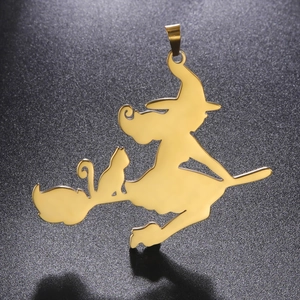 Macro detail of a golden witch on broomstick pendant with cat silhouette on dark background