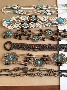 Detail view of Bohemian woven waist chains with turquoise and vintage metal charms