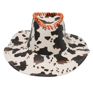 Detail of western cow print hat featuring orange braided stitching and stiff texture