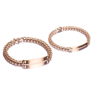Detailed view of two polished rose gold cuban chain bracelets with rectangular bar