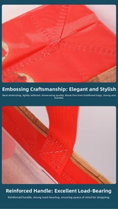 Detail showing the embossed bottom and reinforced cross-stitching on the red gift bag