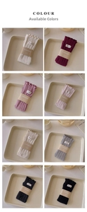 Ribbed knit arm warmers with ruffled edges shown in eight assorted colors for winter