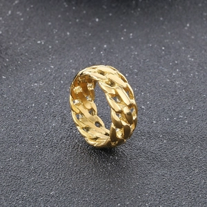 Close-up of golden punk style chain link ring with polished titanium steel texture