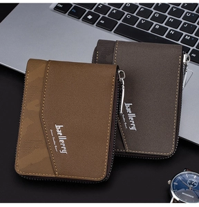 Close-up of light and dark brown textured PU leather wallets on a business desk
