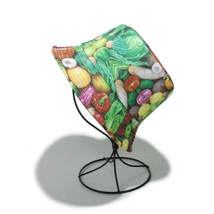 Detailed close-up of colorful vegetable print on cotton canvas sun bucket hat