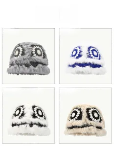 Detailed color options of plush monster beanies with large eyes and knit textures